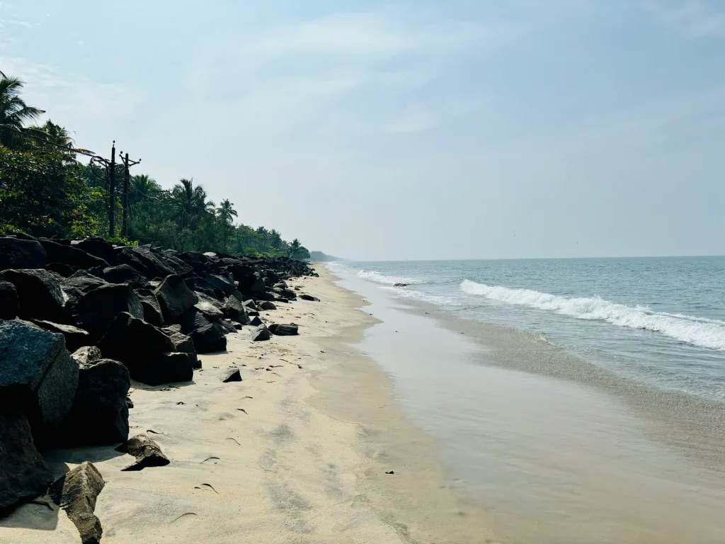 A long sandy beach stretching into the horizon.